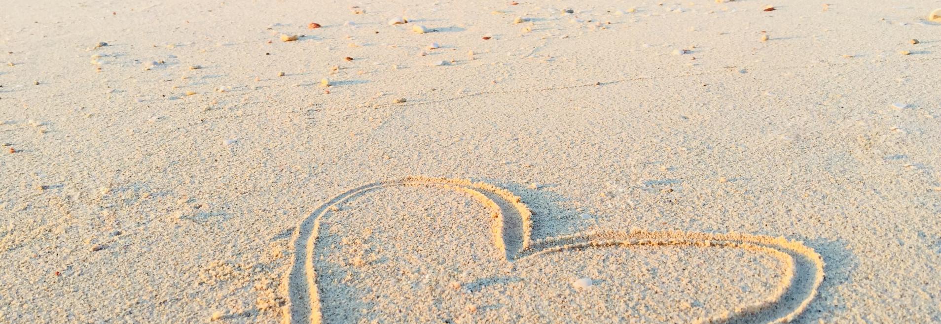 heart drawn in sand